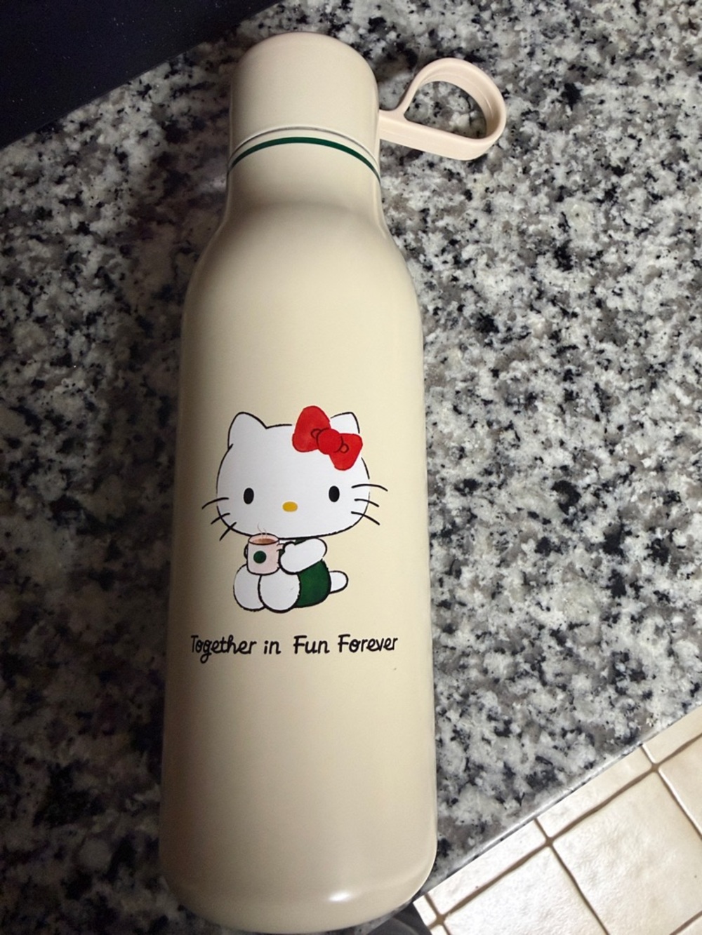 Sanrio Cream Bottle with Red Bow and Green Accent
